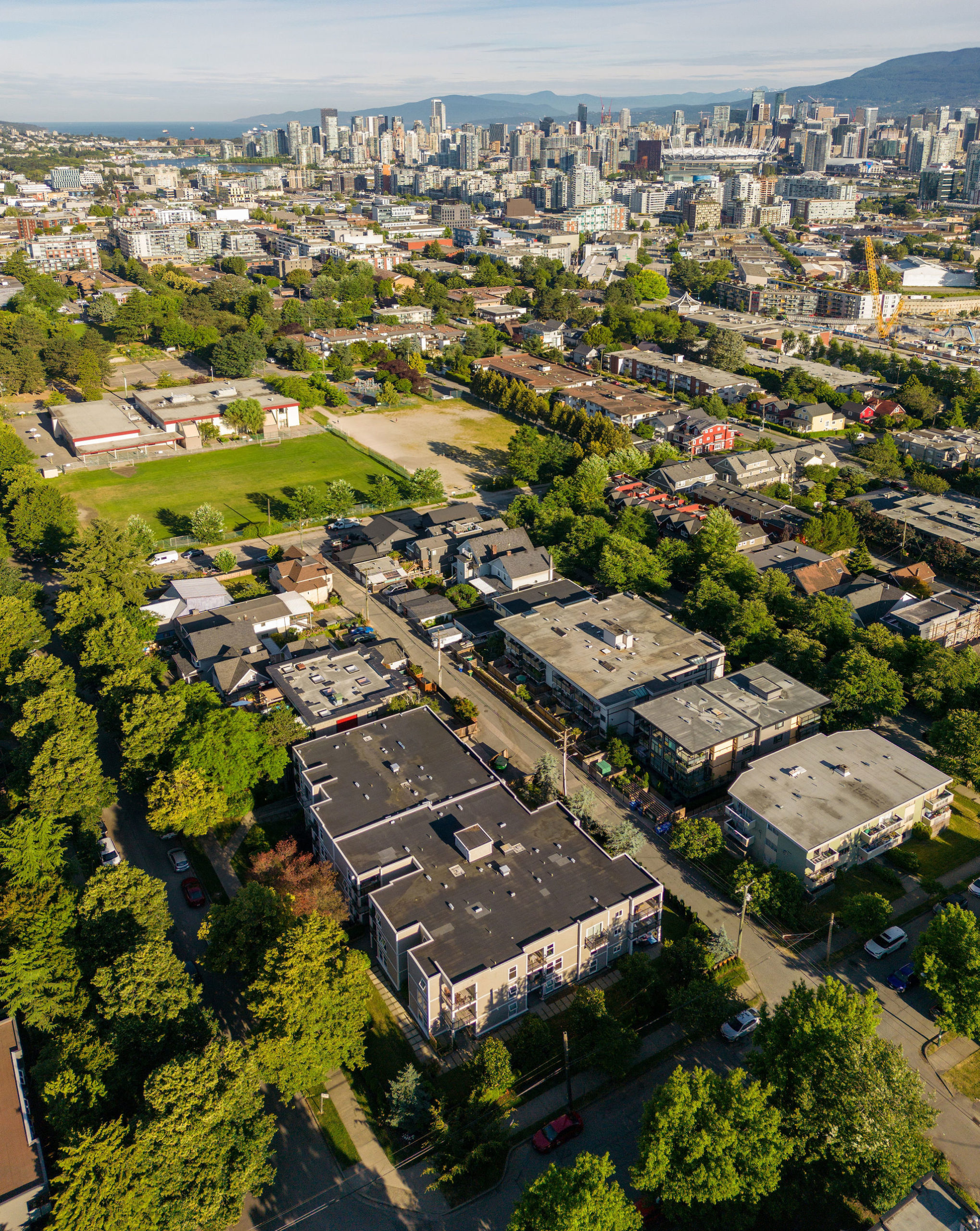 An aerial view of Watson Manor, a three-storey residential building at East 8th Avenue and Carolina Street in Mount Pleasant, Vancouver.